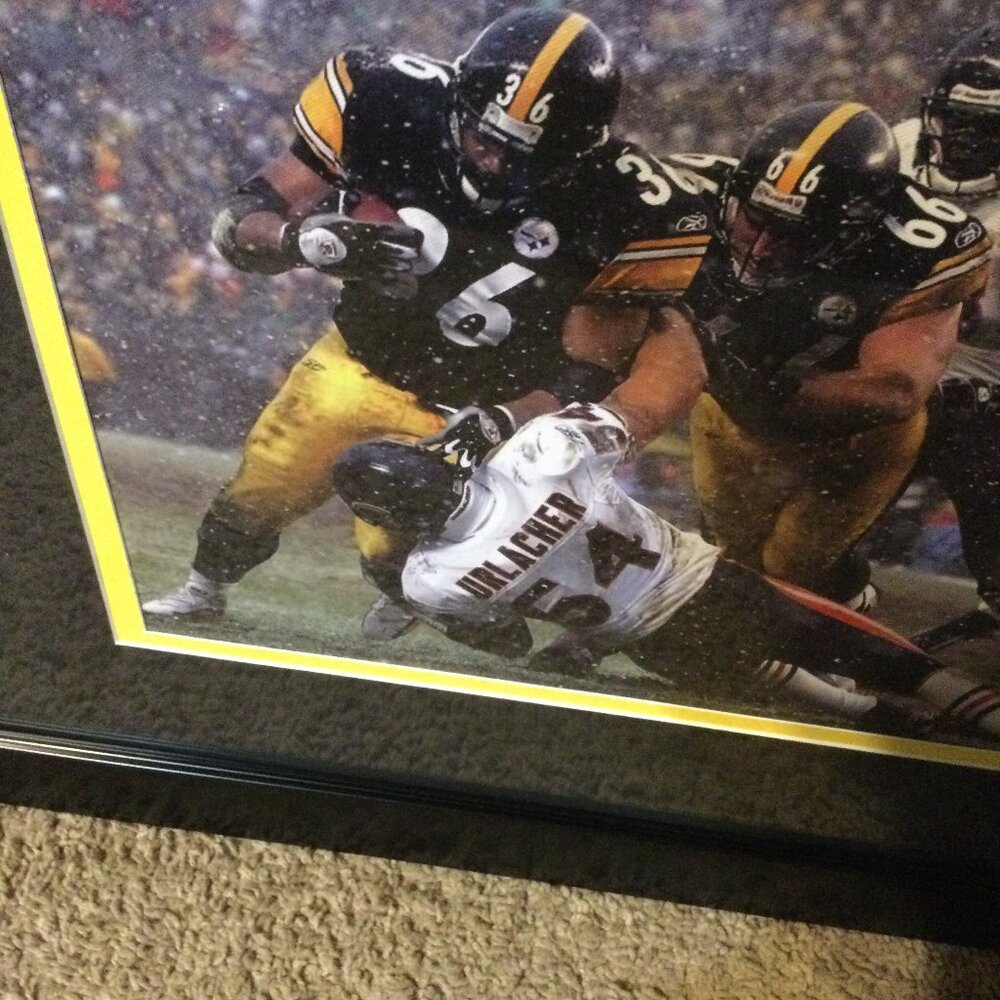 Pittsburg Steelers Jerome the bus bettis in a black frame with black and yellow.